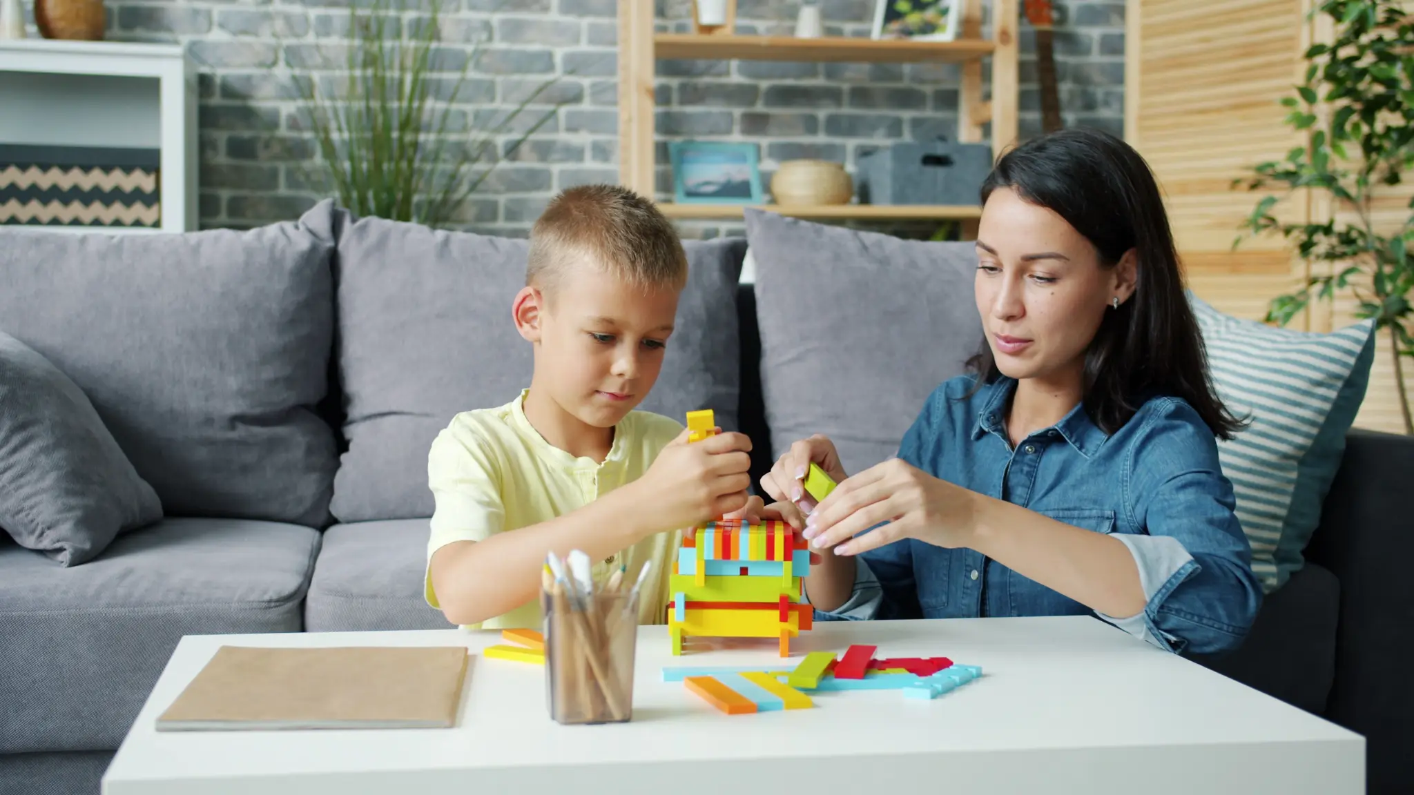 AspireAutism therapist supporting a child during an in-home ABA session