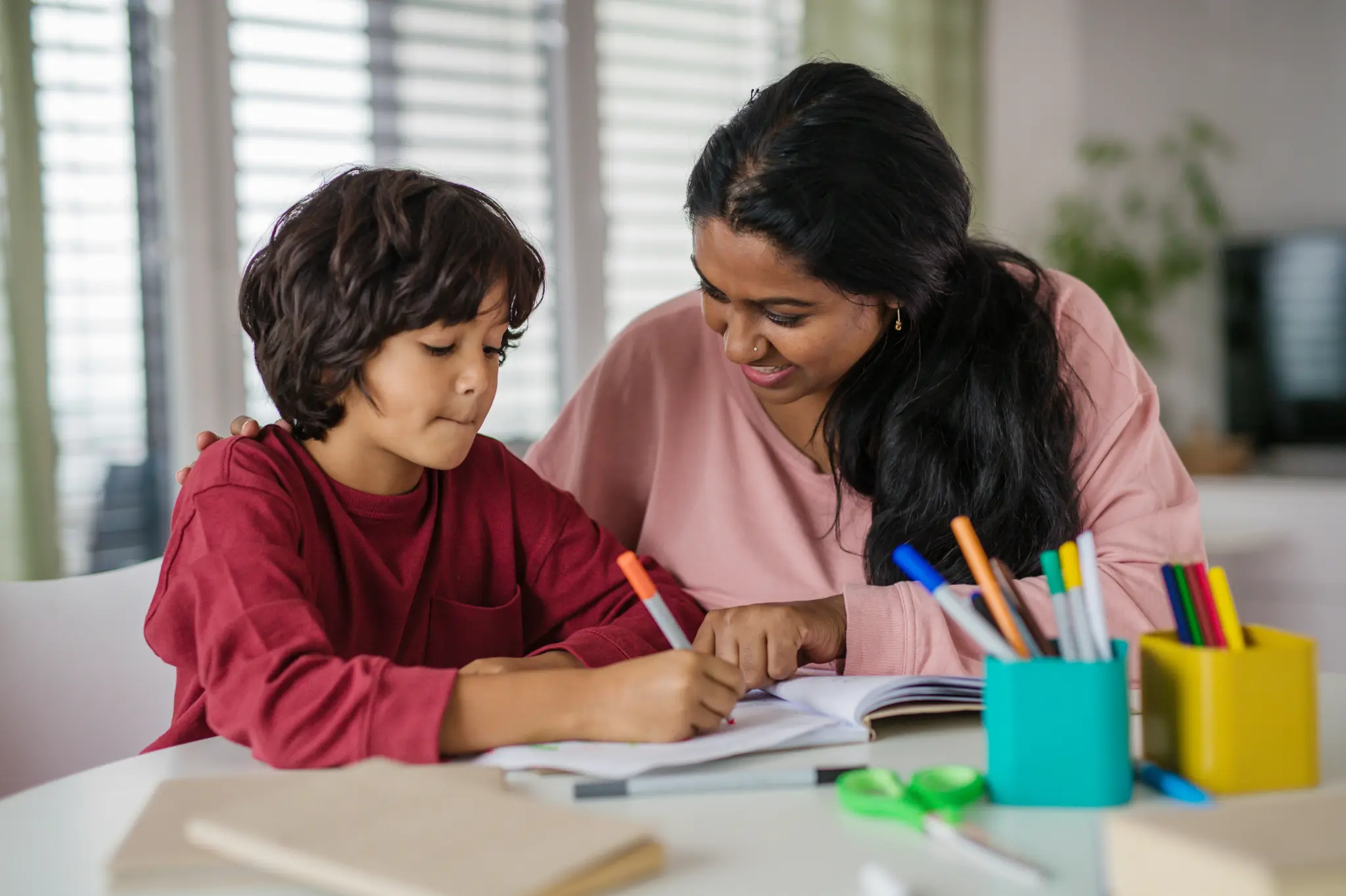 Illustrative lifestyle scene of a child learning through play with a supportive adult at home