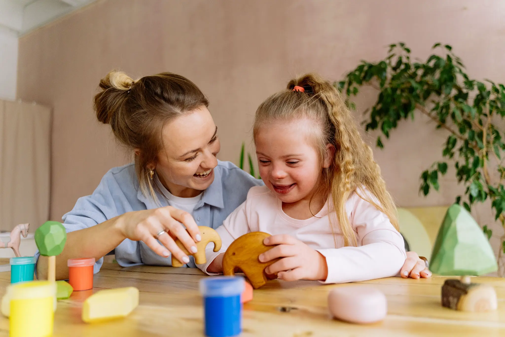 Illustrative lifestyle scene of a child learning through play with a supportive adult at home