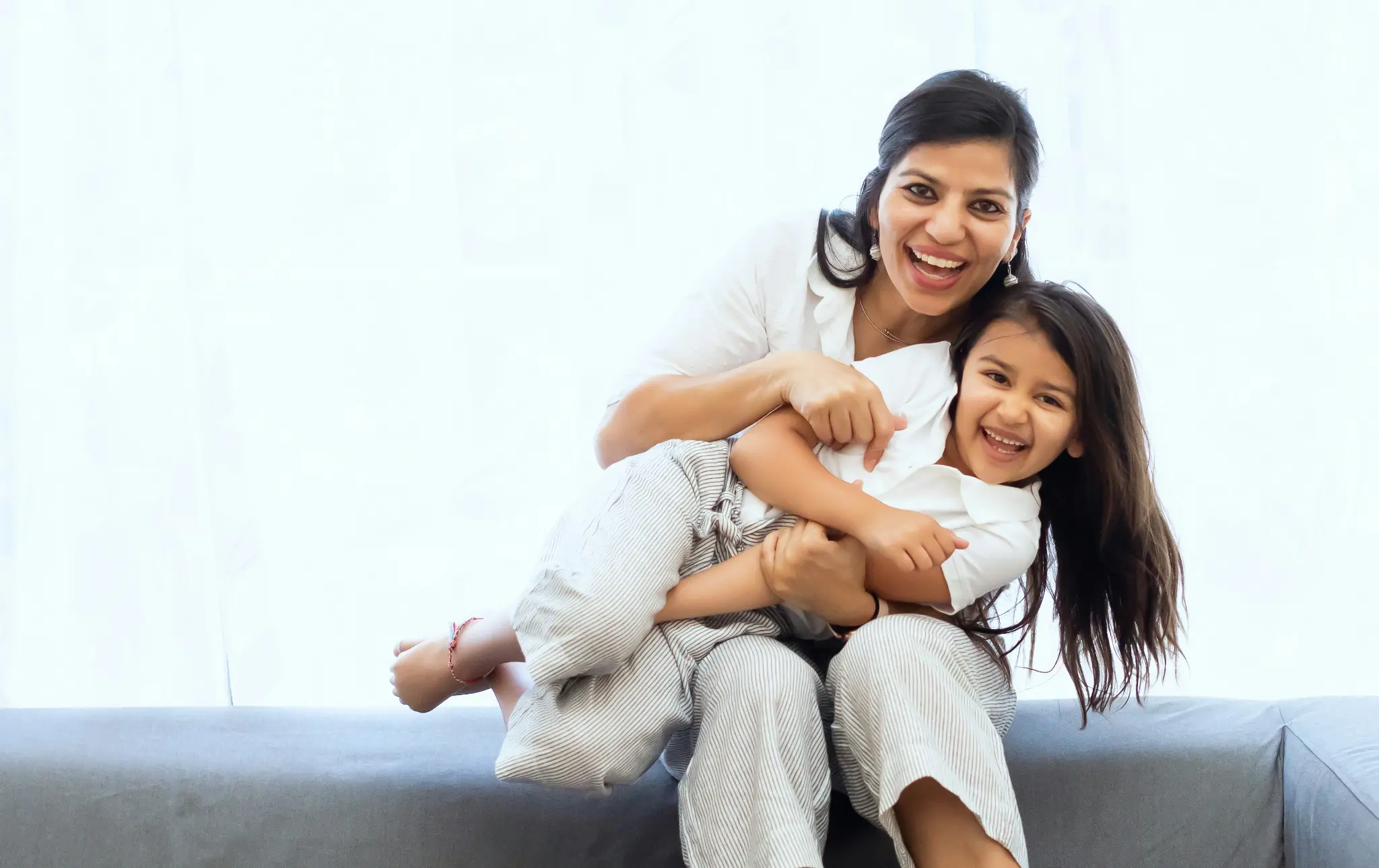 Therapist supporting a child during a practical home activity